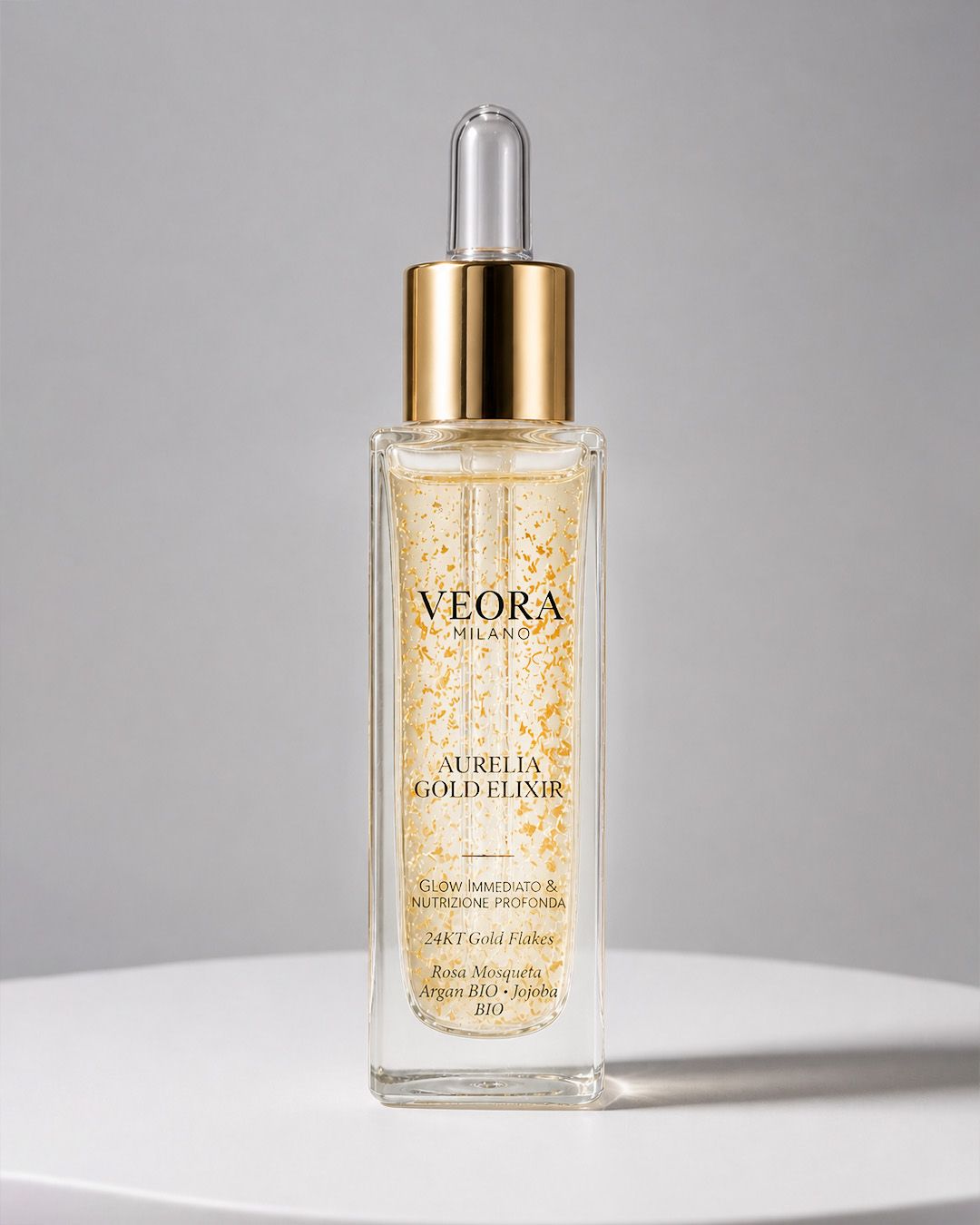 Flacone Veora Milano Aurelia Gold Elixir con contagocce, interno decorato con foglie d'oro 24 carati.